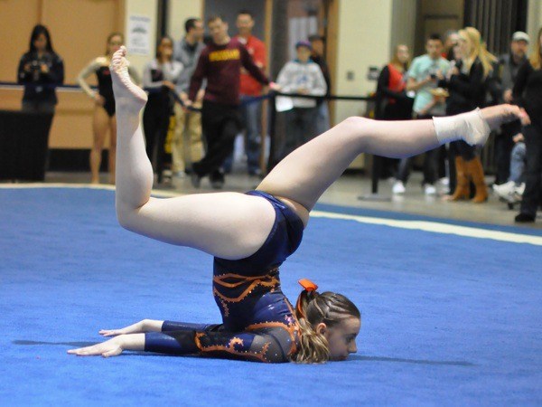 Auburn Mountainview's Cassie Hunt performs on the floor during the Washington State 3A Gymnastics Championships.