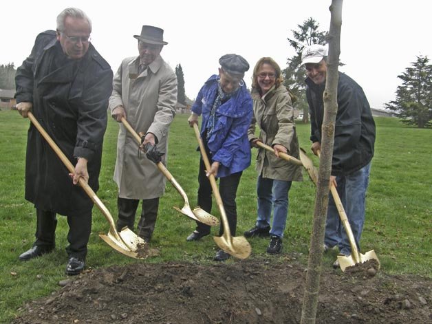 Planting a Green Vase Zelkova at Les Gove Park Tuesday in celebration of Arbor Day are