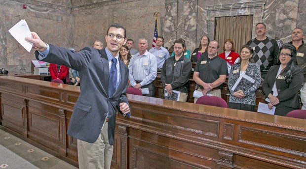 Sen. Joe Fain points out some features on the Senate floor with a touring group from the Leadership Institute of South Puget Sound on Wednesday.