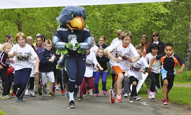 Blitz leads the starts of the 5K run Saturday at Roegner Park.