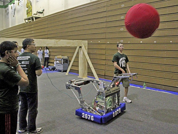 Members of the Spartabots FIRST Robotics Team 2976 from Skyline High School fine tune their bot's catapult during a break in the action at the FIRST Robotics competition this past weekend at Auburn High School. Team 2976 finished 16th out of 36 teams with 26 points. The event was won by Issaquah Robotics Society 1318 with 75 points.