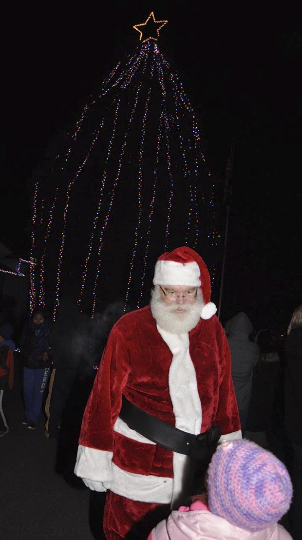 Holiday sights and sounds graced Pacific City Hall at the town’s tree lighting ceremony last Friday night. Santa took time to visit children. The event included a sing-along