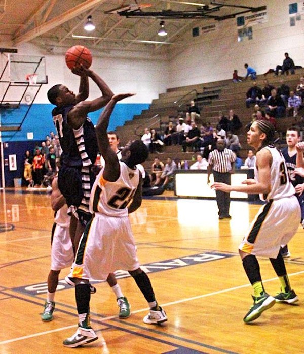 Auburn Riverside's Derek Brown elevates for two of his school record 49 points against Kentridge.