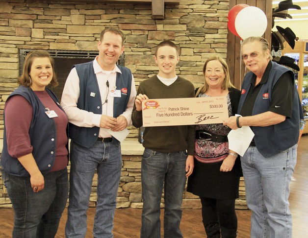 Coastal Farm & Ranch presented a $500 college scholarship to Auburn High's Patrick Shine.