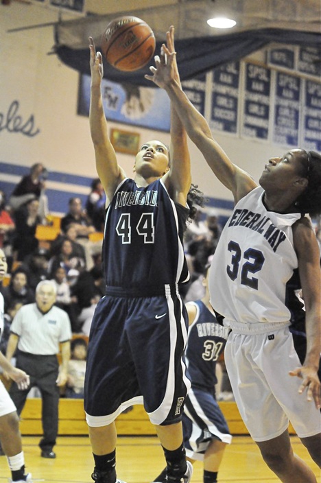 Auburn Riverside's Kathleen Cooper grabs a rebound over Federal Way's Jaleecia Roland.