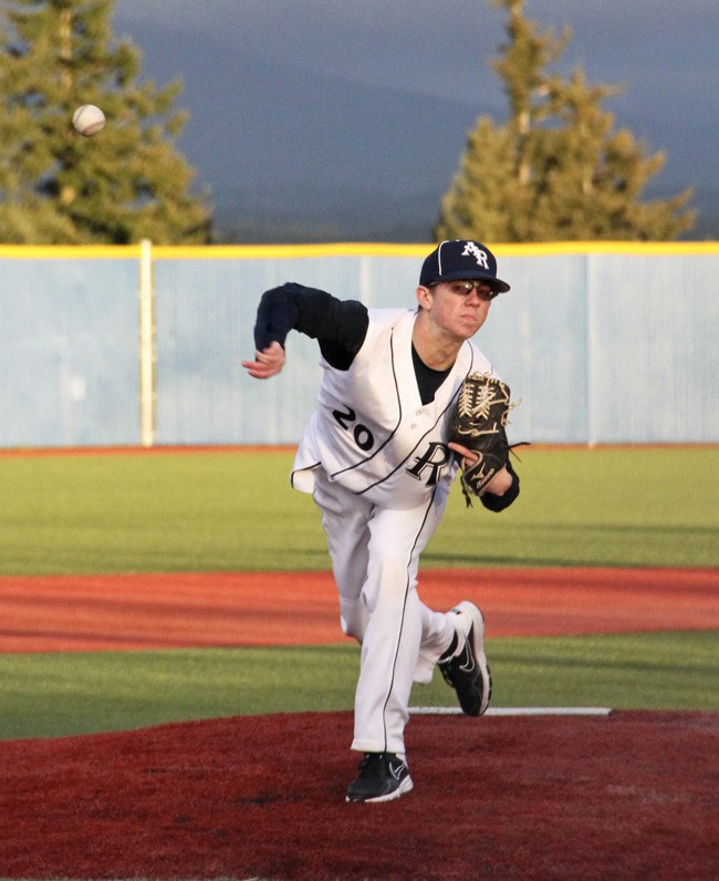 Auburn Riverside junior pitcher Adam Parke delivers against Kentlake.