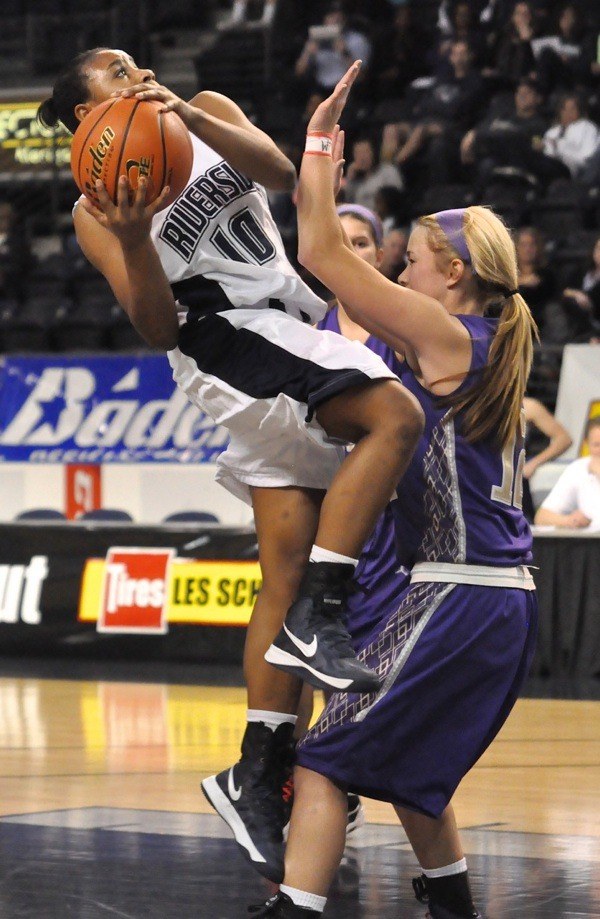 Auburn Riverside's Brittani Williams elevates for a basket.