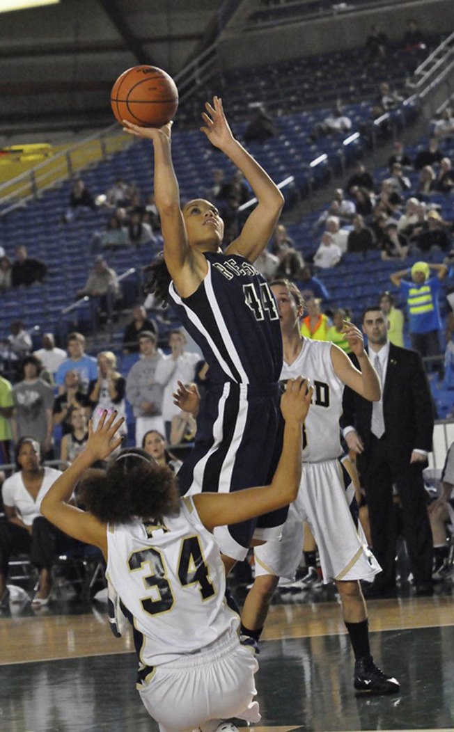 Kat Cooper takes to the air during the 2010 Washington State 4A girls title against Mead at the Tacoma Dome.