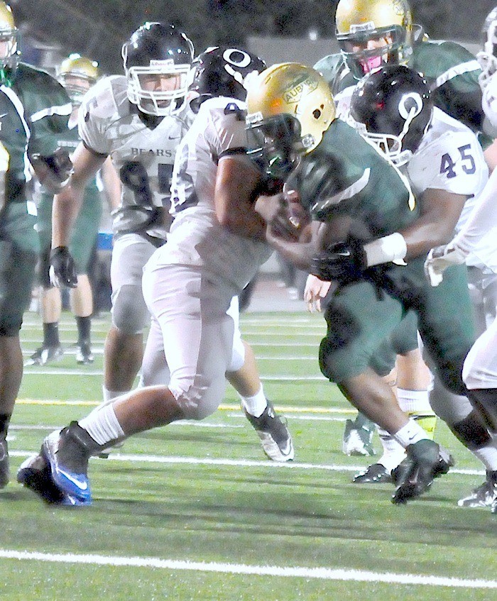 Auburn running back Darnell Hagans punches it in for touchdown against Olympia.