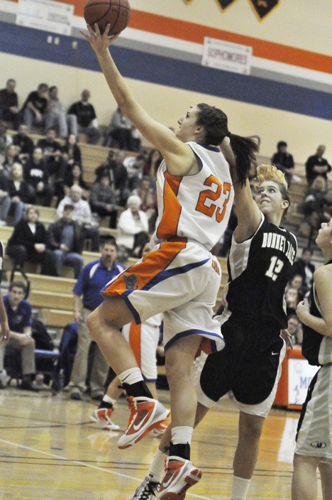 Stephanie Smolinski blows by Bonney Lake’s Raini Weigand. Smolinski scored 12 points for the Lions.