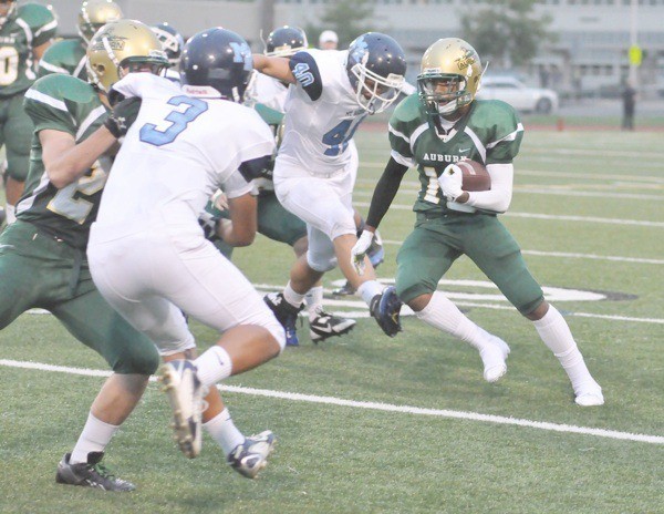 Senior halfback Daerell Beck runs the ball against Mount Rainier.