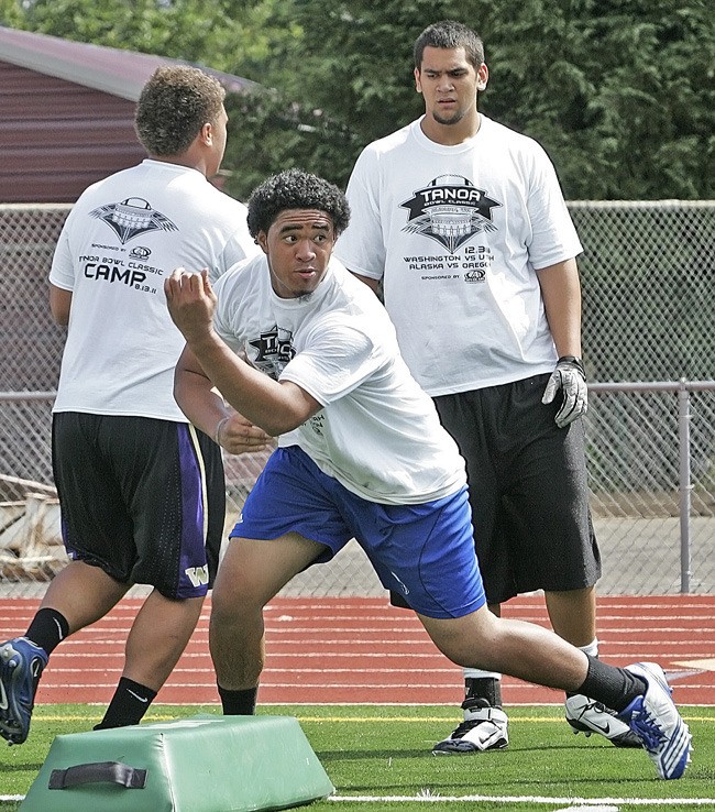 Auburn Mountainview junior Nick Aumua runs through lineman drills at the Tanoa Bowl camp this past summer.