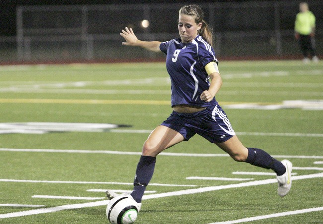 Auburn Riverside senior Danielle Robinson launches a penalty kick during the Ravens' 2-0 victory over rival Auburn.