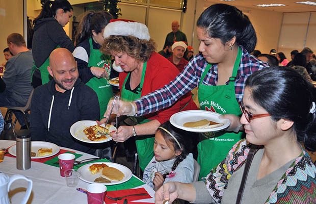 Mayor Nancy Backus and her helpers serve up breakfast to guests at the Senior Center on Saturday.