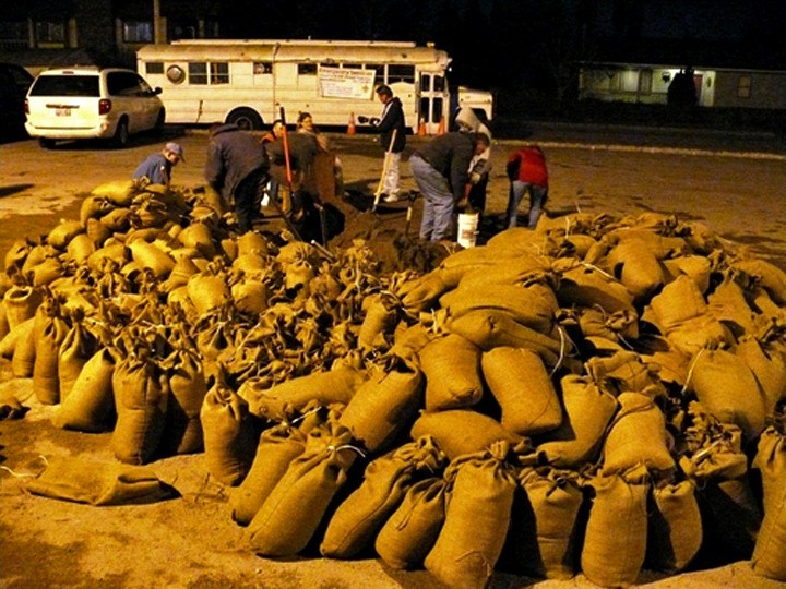 Members of Boy Scout Troop 835 fill sandbags in Pacific