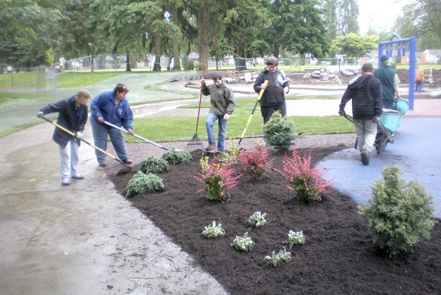 Boy Scout Troop 401 volunteers helped prepare the Discovery Playground before today’s grand opening.