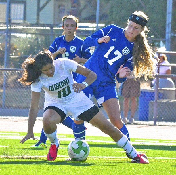 Auburn's Linda Karout battles for possession.