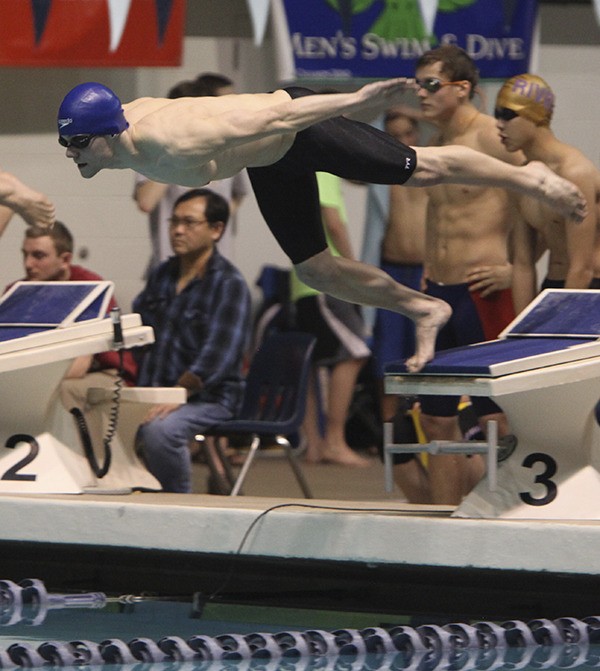 Owen Lempert dives in for is leg of the 200 free relay.