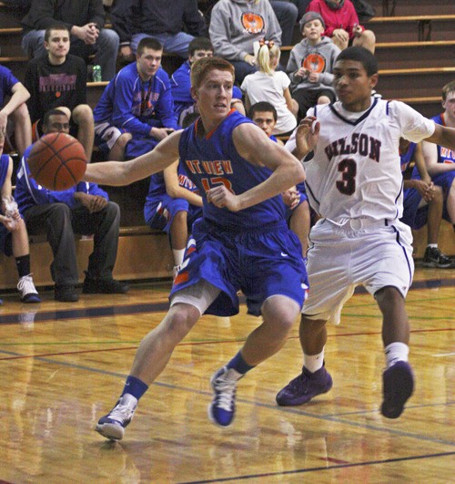 Auburn Mountainview senior Neal Leatherman drives against Wilson.