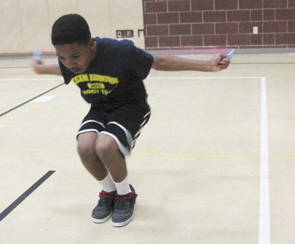 Team Auburn's Aariq White practices a jump at Ilalko Elementary School.