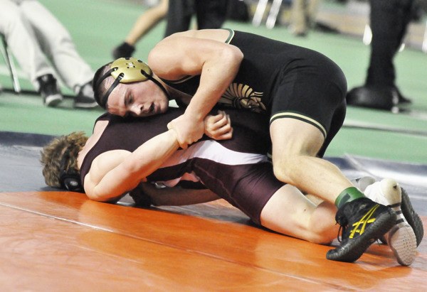 Dylan Rutledge manhandles an opponent during last year's Mat Classic Washington State Wrestling Championships at the Tacoma Dome. Rutledge grapped the state title at 171 pounds.