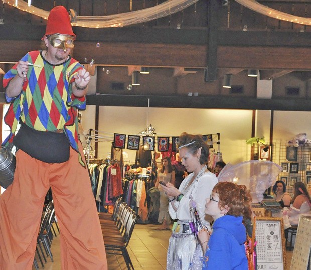 Matthew VanZee as Harley Quinn shows a trick to the young audience at the Spring Fairy Festival last year.