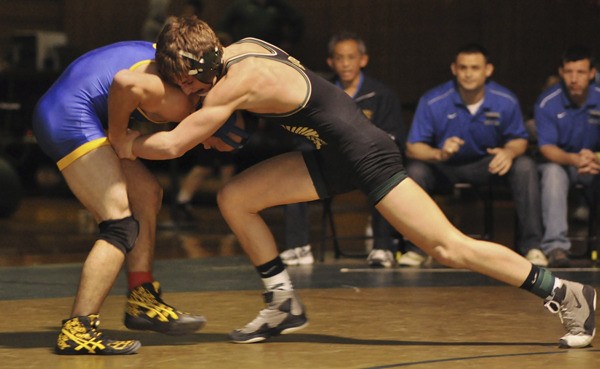 Auburn's Tyson Gaillac squares off against Tahoma's Cruz Velasquez during the 132-pound title match at the SPSL Championship tourney.