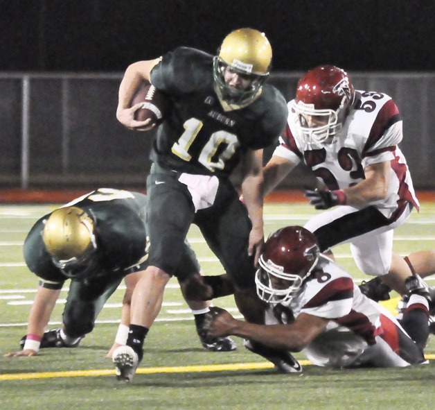 Max Pratt exploits a hole during the Trojans’ South Puget Sound League North 4A victory against Kentlake earlier this season.