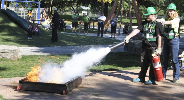 CERT (Community Emergency Response) team members Brian McDaniel and Darlene Aguiluz conduct a fire suppression drill at Auburn’s fifth annual Disaster Preparedness Fair last Saturday at the Les Gove Community Campus.