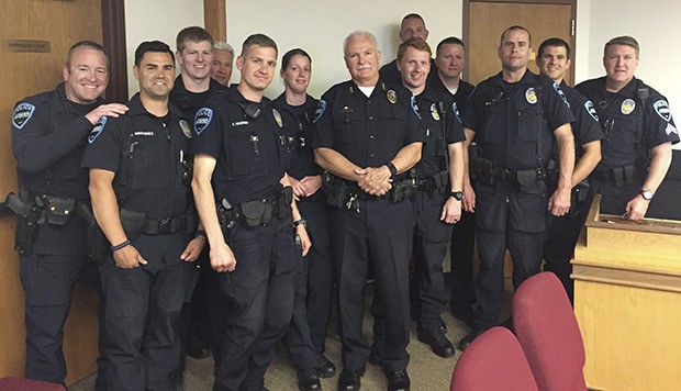 Hail to the chief: A dozen Auburn Police officers appear at Monday’s City Council meeting to honor their boss