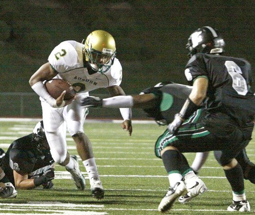 Auburn running back Alphonse Wade evades Kentwood defender's this past Friday at French Field.