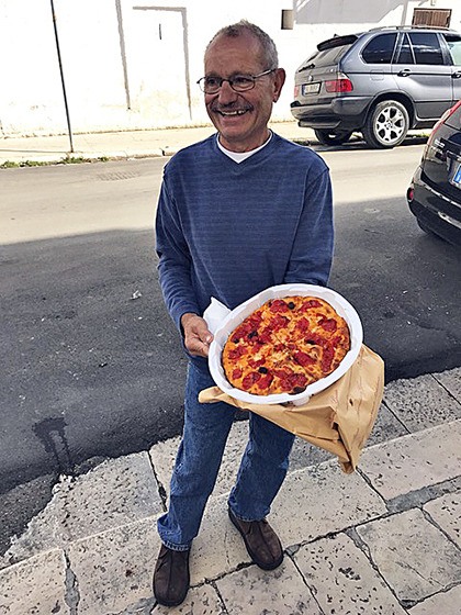 Auburn’s Tony Demonte enjoys some focaccia  bread