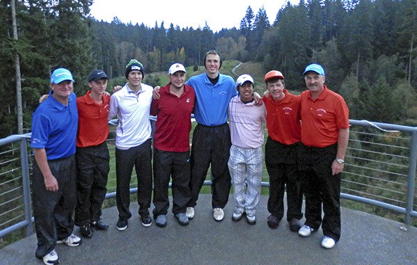 Coaches and members of the Auburn Mountainview boys golf team pose at Gold Mountain Golf Course in Bremerton. From left to right