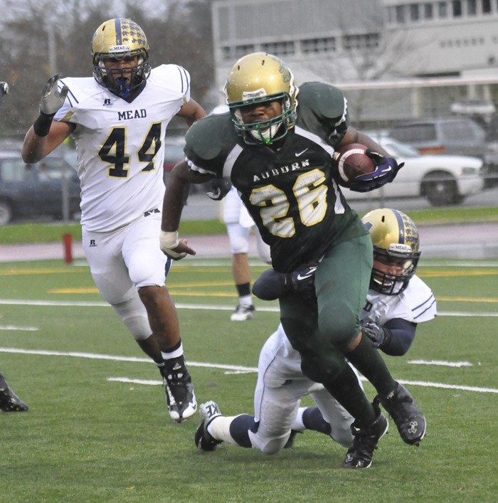 Auburn senior running back Brendan Greer carries the ball against Mead.