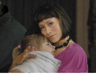 Melanie Roach holds her daughter Camillle