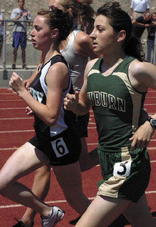 Auburn sophomore Micheal Paulston keeps pace with Bonney Lake’s Veronica Stinnett during the 1