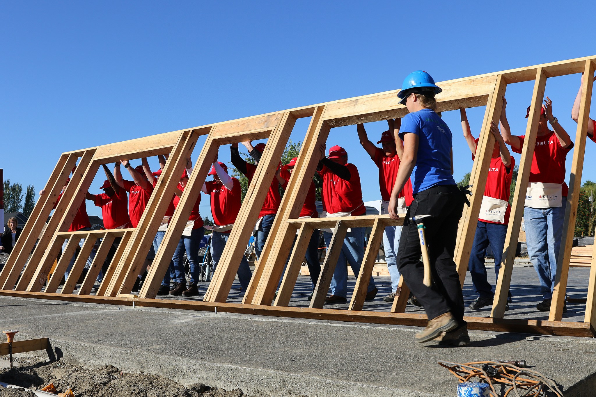 Volunteers from Delta Air Lines erect a frame for a home in Pacific last week. COURTESY PHOTO