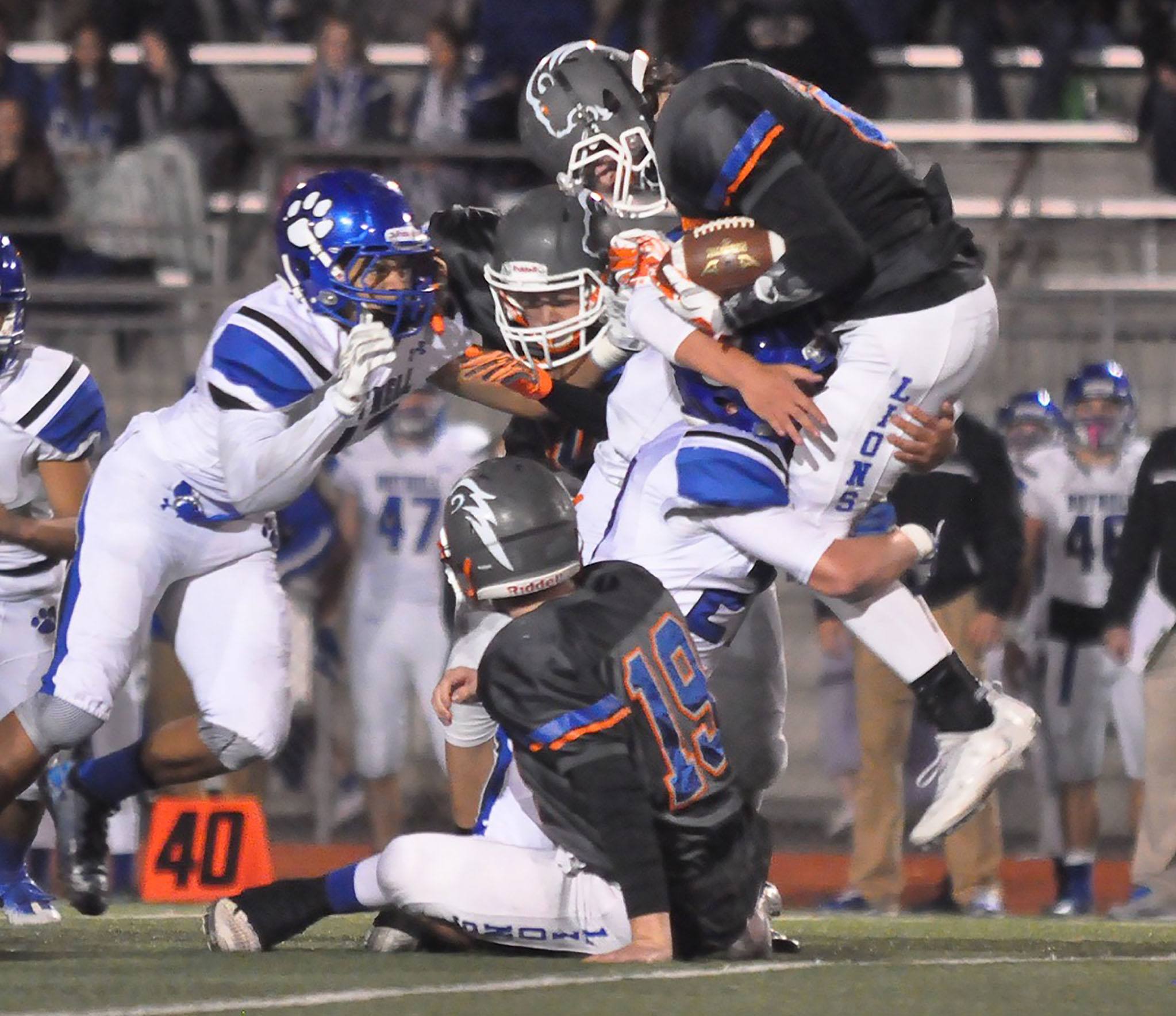 The Bothell defense stacks up Auburn Mountainview ball carrier Alex McBee during playoff action Friday night at Auburn Memorial Stadium. RACHEL CIAMPI, Auburn Reporter