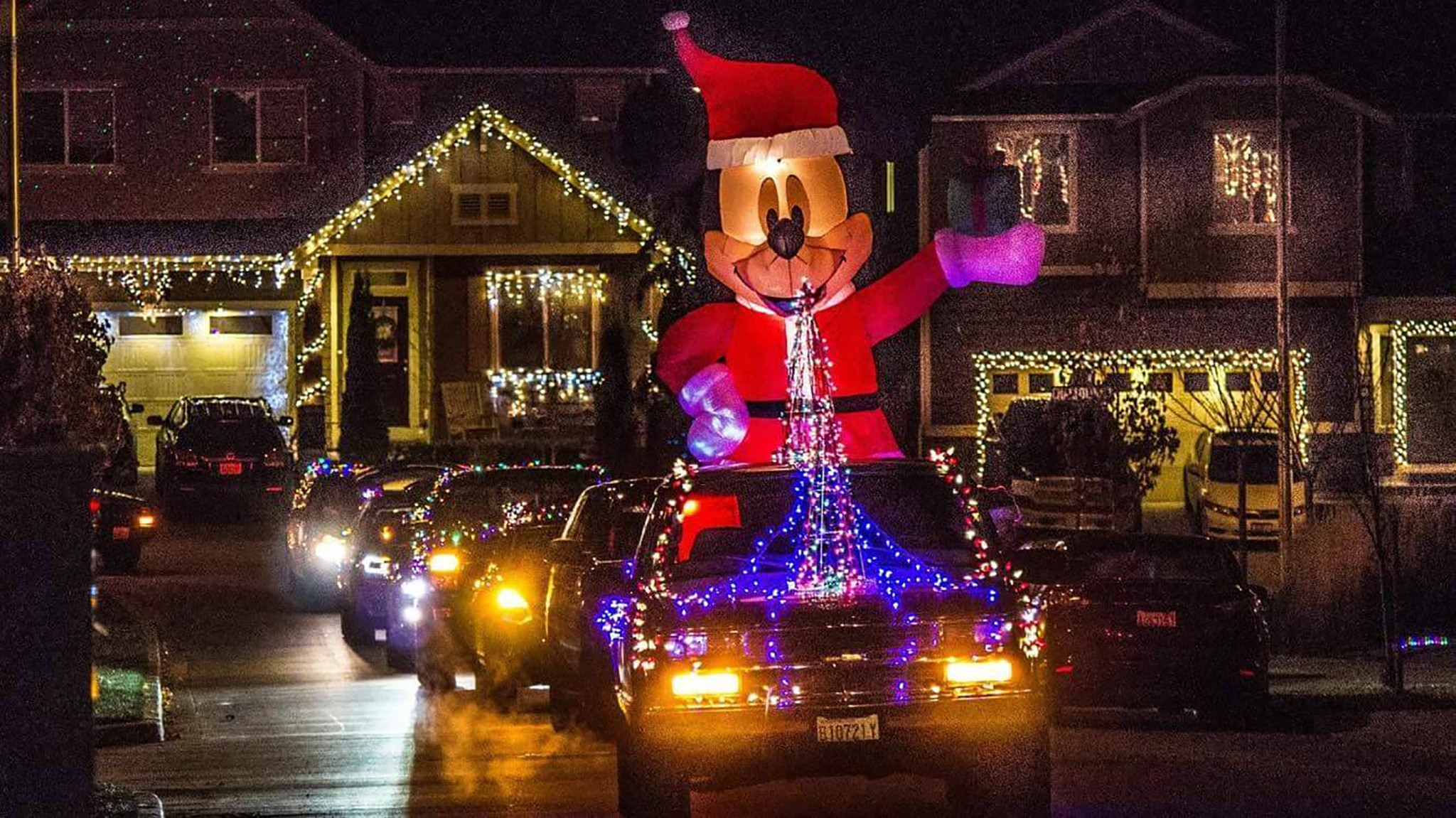 Residents drove cars decorated in Christmas lights and went through the neighborhood gathering donations. COURTESY PHOTO