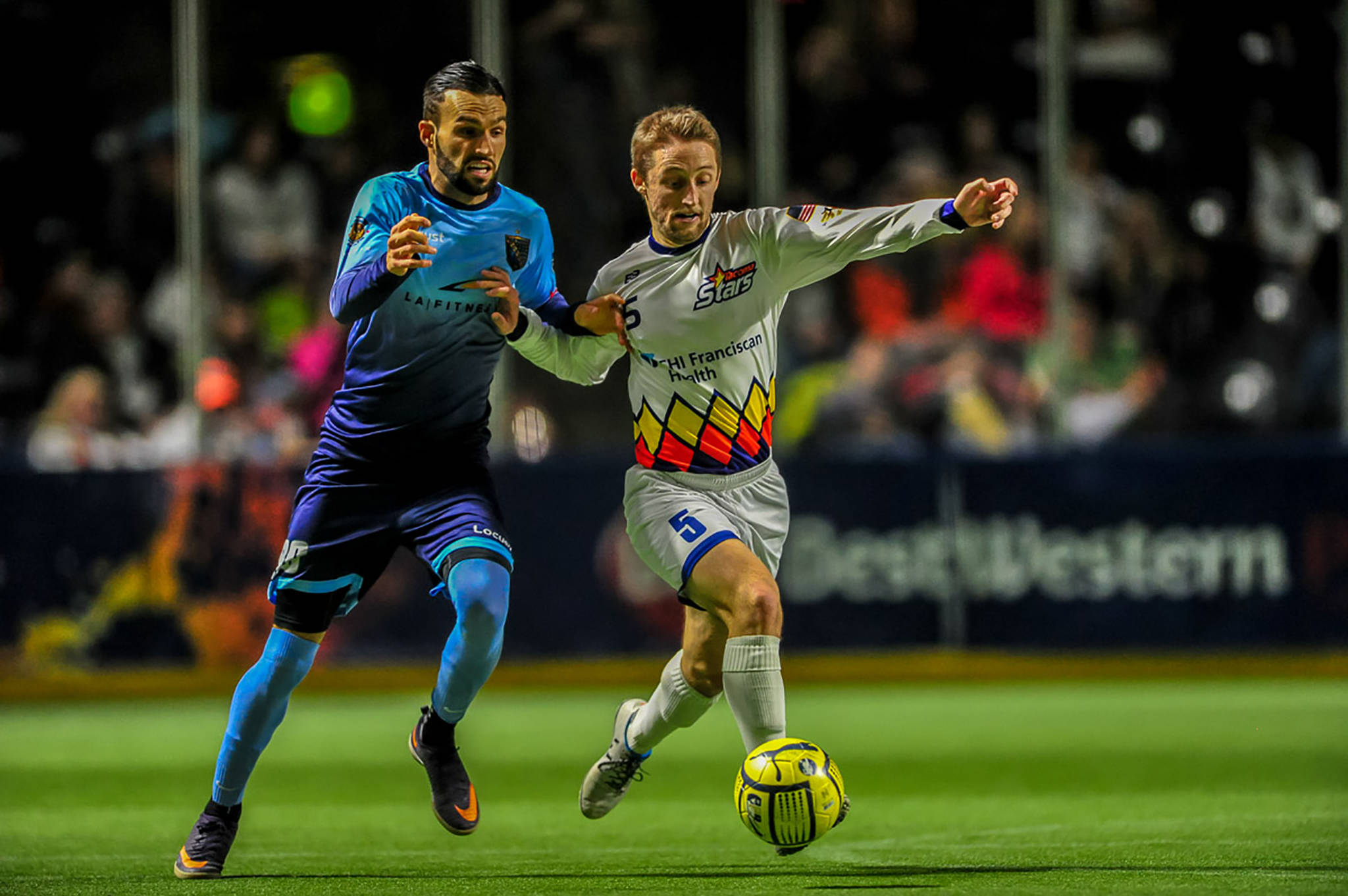 The Stars’ Trevor Jensen battles a Socker player for the ball during MASL action Saturday night at the ShoWare Center. COURTESY PHOTO, Wilson Tsoi/Tacoma Stars