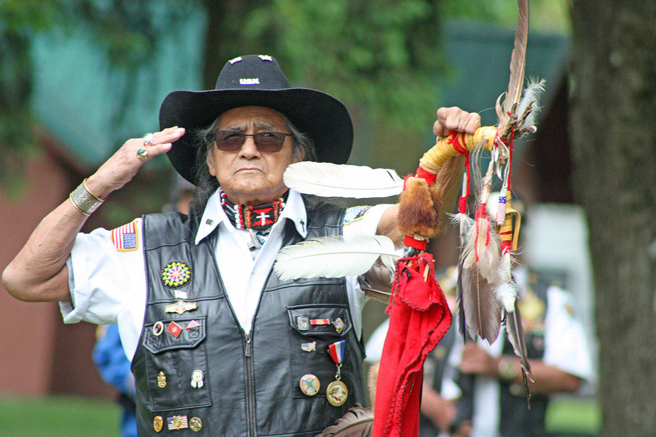 Bob Sison, veteran and chaplain of the Inter-Tribal Warrior Society, salutes during the Memorial Day ceremony at Auburn’s Veterans Memorial Park on Monday. MARK KLAAS, Auburn Reporter