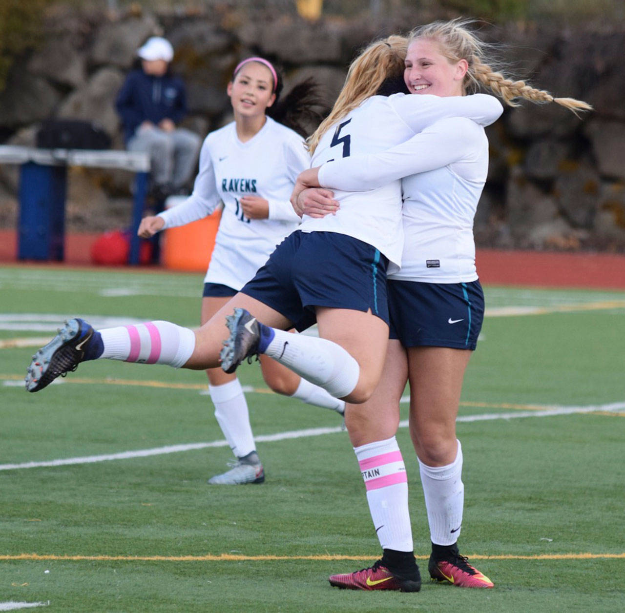 Auburn Riverside’s Olivia Boulet, left, hugs her older sister, McKenna, after scoring one of her three goals against Thomas Jefferson on Friday. RACHEL CIAMPI, Auburn Reporter