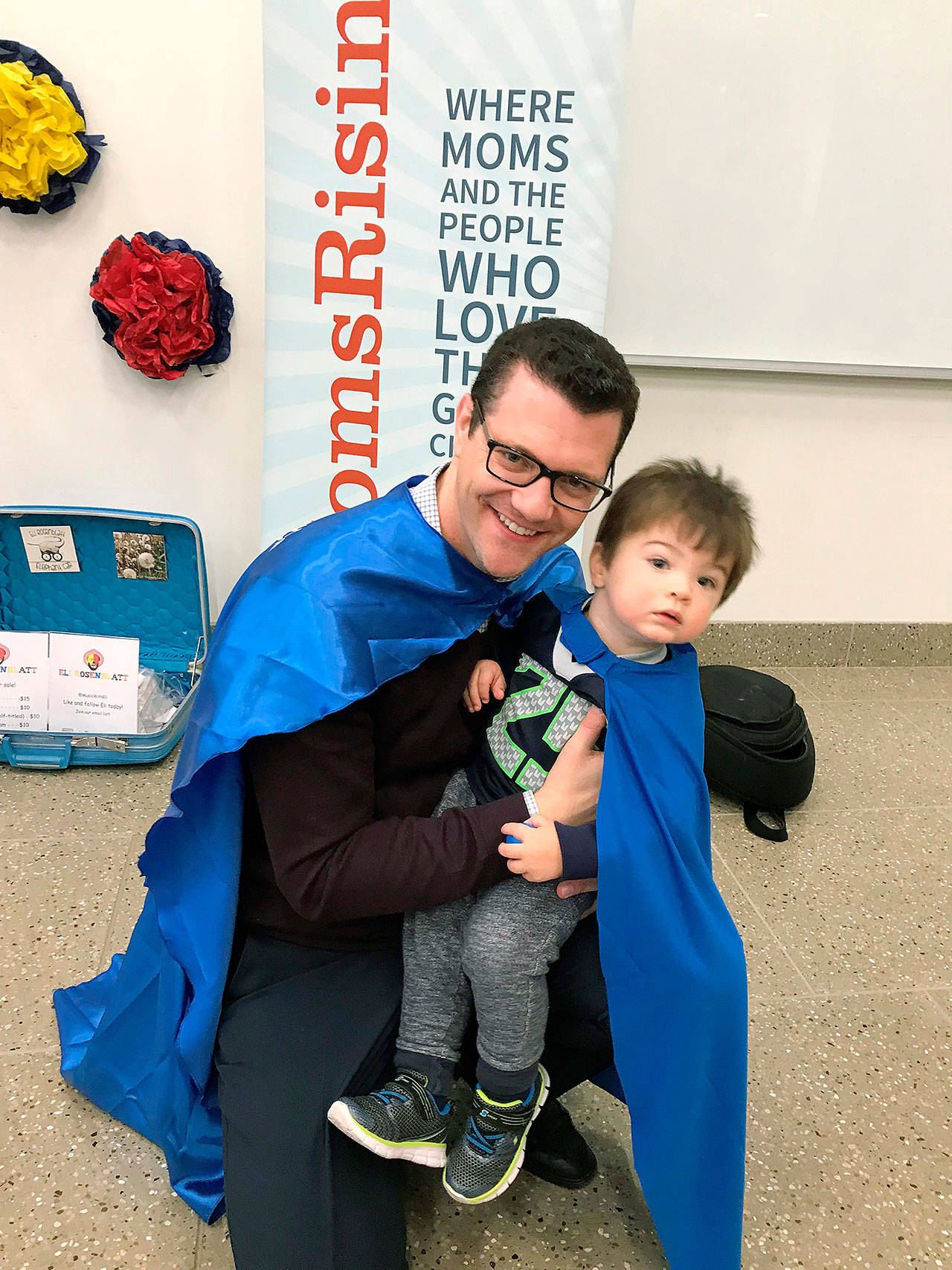 Sen. Joe Fain, R-Auburn, and his son, Moxon, at the celebration Sunday. COURTESY PHOTO, MomsRising