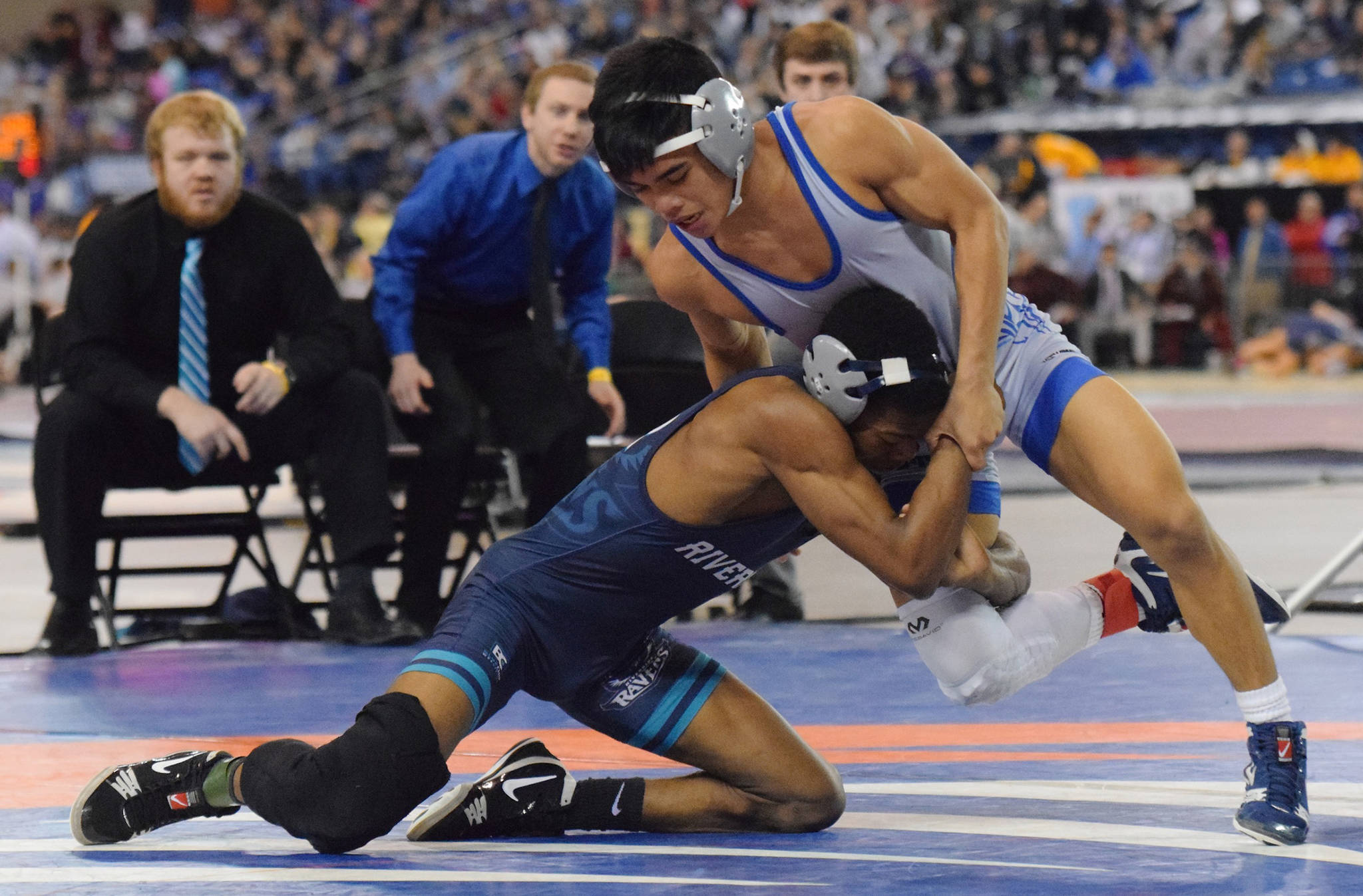 Curtis’ Aizayah Yacapin, right, tries to maneuver around Auburn Riverside’s Yusef Nelson during their 113-pound title bout at Mat Classic XXX on Saturday. RACHEL CIAMPI, Auburn Reporter