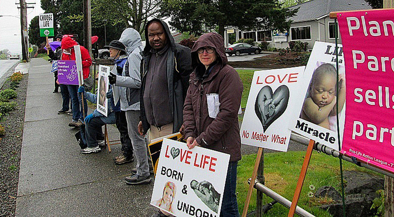 People protest against taxpayer funding for abortion outside of a Kent Planned Parenthood clinic on Saturday. COURTESY PHOTO, St. Stephen the Martyr Catholic Church