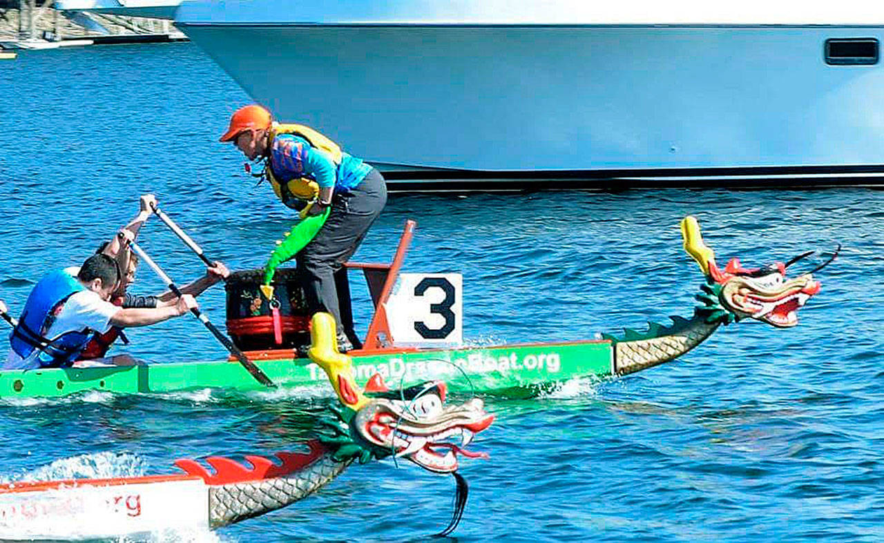 Coach Lesley Blyth shouts instruction to her dragon boat team during recent action. Washington Masters Dragon Boat teams compete at the Club Crew World Championships in Szeged, Hungary, in July. COURTESY PHOTO