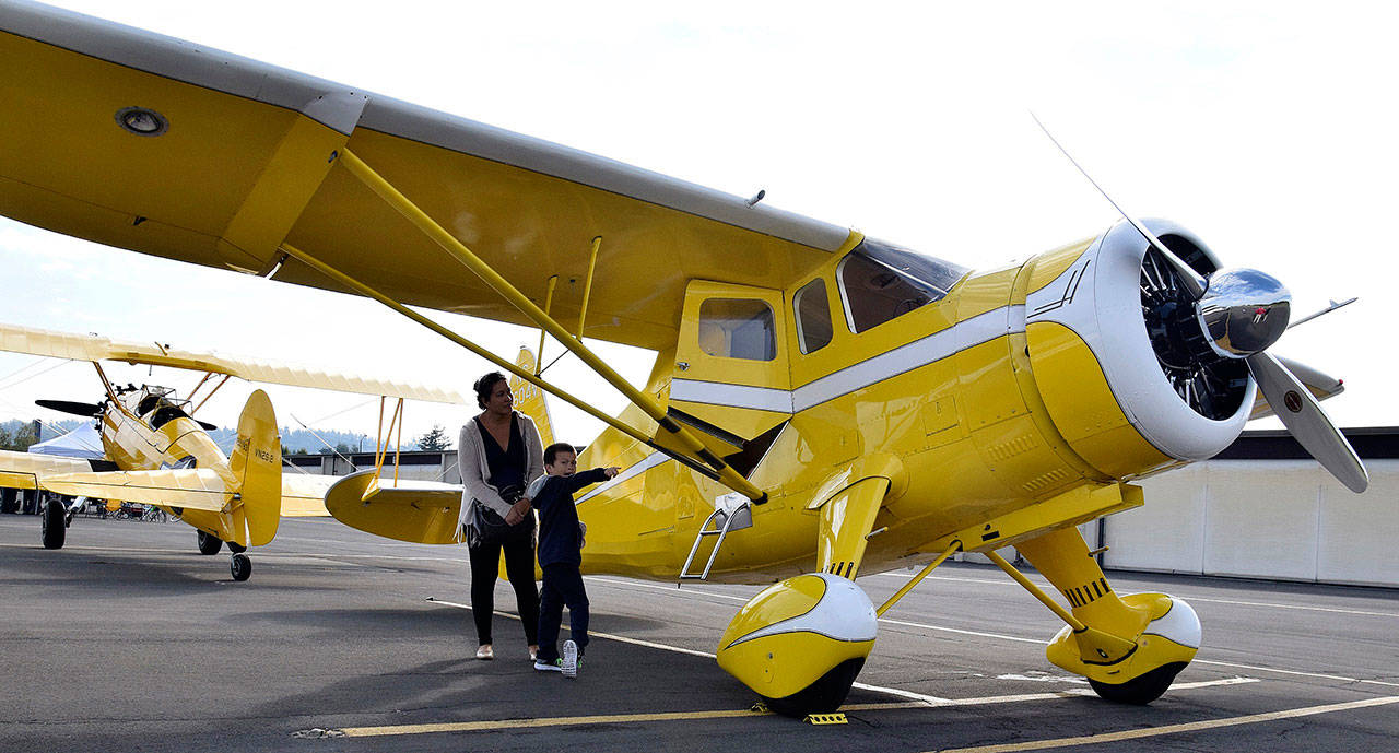 Michelle McLean and her son Sean, 7, check out a plane during Airport Appreciation Day at the Auburn Municipal Airport last Saturday. RACHEL CIAMPI, Auburn Reporter