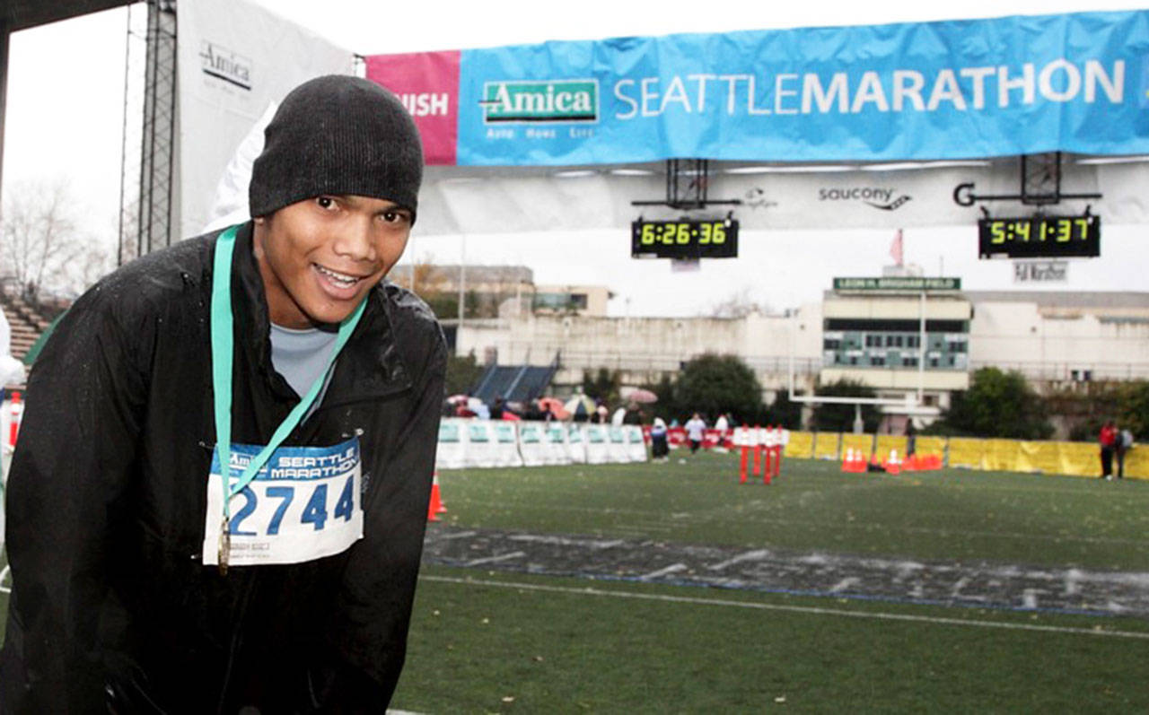 Peter Phan, then a 26-year-old Algona man and a kidney dialysis patient for nearly 10 years, competes in the Seattle Marathon on Nov. 27, 2011. He completed his first marathon in 5 hours, 41 minutes and 25 seconds, 1,247th overall in a field of 11,007 competitors. REPORTER FILE PHOTO, courtesy of CBBell.com