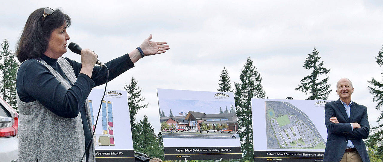 Evergreen Heights Principal Anne Gayman, who will become the principal at the new elementary school set to open in 2020, speaks at the groundbreaking on April 20. Listening is Jeff Grose, the Auburn School District’s executive director of capital projects. RACHEL CIAMPI, Auburn Reporter