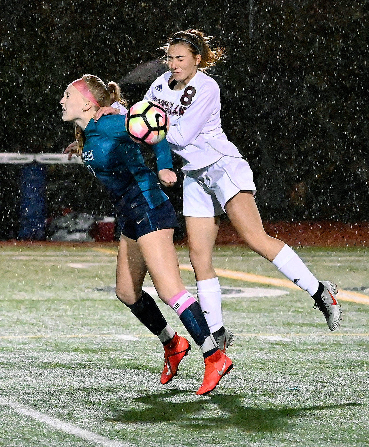 Auburn Riverside’s Kayla Rydberg, left, and Enumclaw’s Nicole Huff vie for the ball during a wet, gusty first half of their NPSL Olympic Division soccer match in October at Auburn Riverside High School. RACHEL CIAMPI, Auburn Reporter